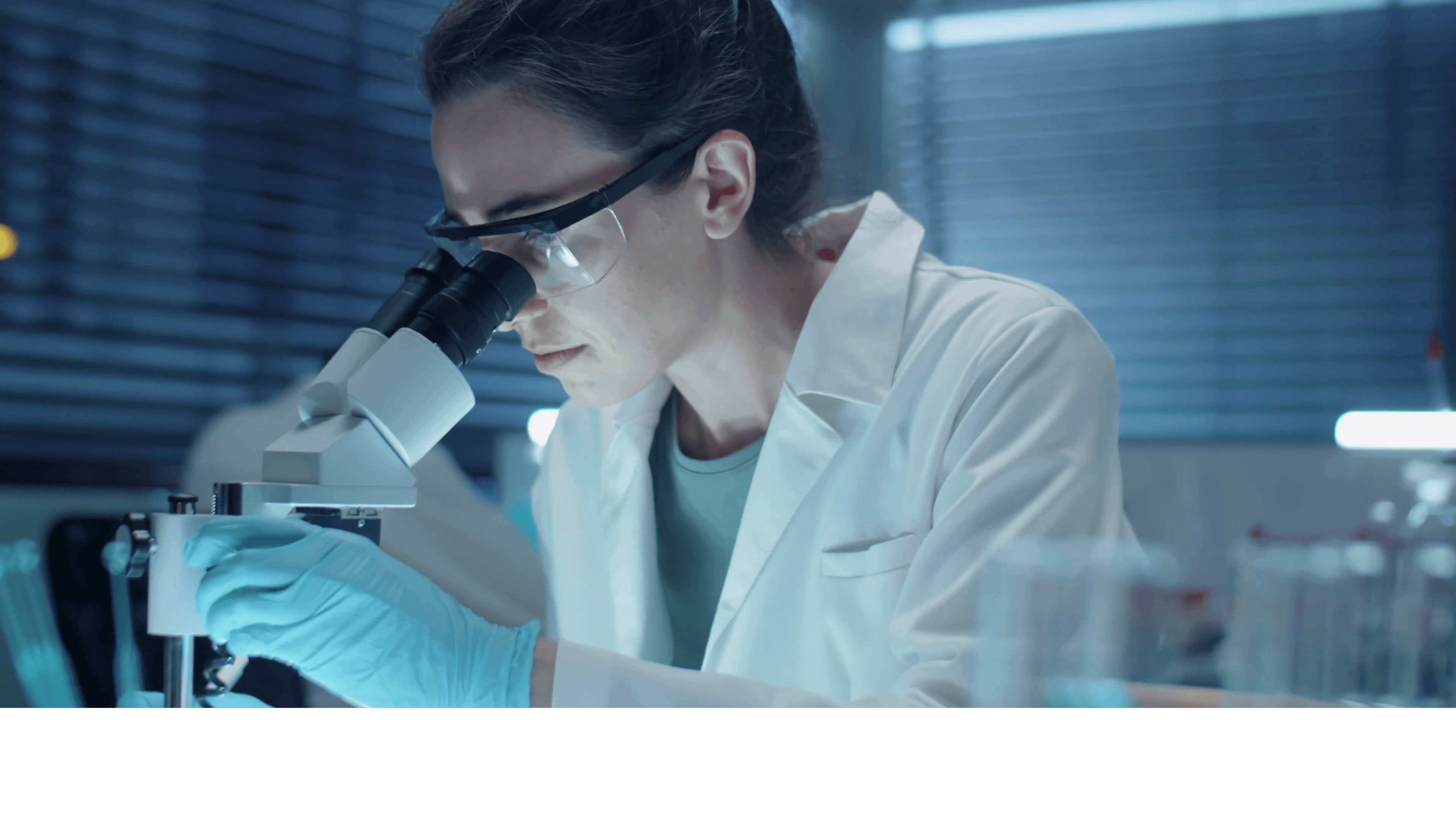 Researcher at a microscope in a laboratory